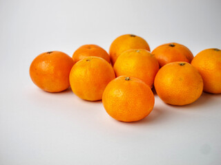 many mandarins on white background