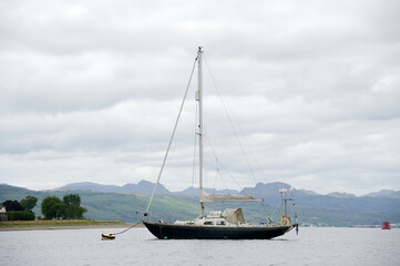 Old yacht sailing boat moored at Gare Loch near Helensburgh