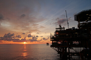 Offshore oil rig at sunset