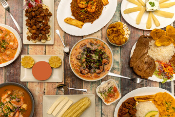 Set of latin cuisine dishes with ceviche, onions with shrimp, steaks with rice and salad, chaufa rice, corn with cheese, fried yucca and fried plantains