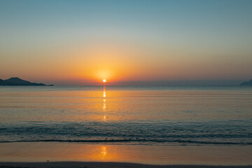 sunrise over the horizon in the sea