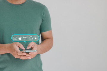 Businessman using Smart Phone with email, call phone, address, and Chat message icons. Customer support hotline Contact us people connection.