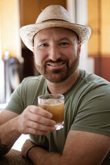 man drinking margarita in mexico