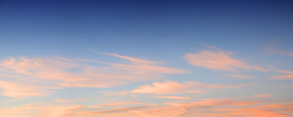 Naklejka na ściany i meble sunset sky blue and pink cirrus clouds panorama