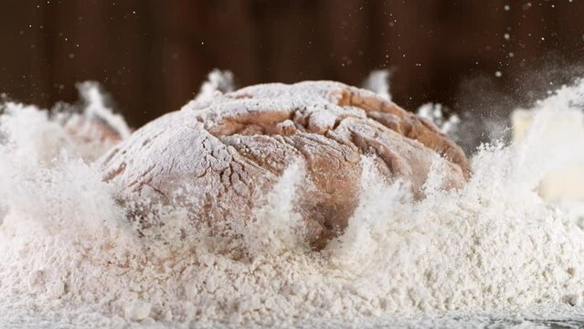 Super slow motion of falling yeast dough into flour. Filmed on high speed cinema camera, 1000 fps.