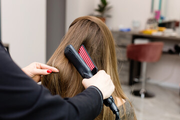 Woman at the hair salon getting her hair styled