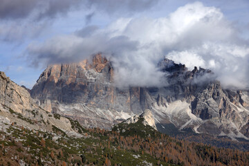 View of Tofane mountains on the background seen from Falzarego pass in an autumn landscape in Dolomites, Italy.