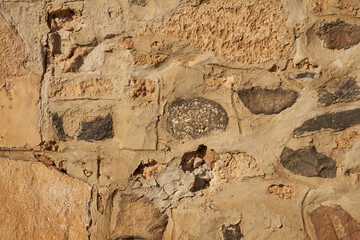 The wall is made of stones and clay as a decorative background.