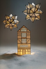 One lantern house in snowdrifts and two stars