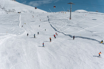 Fototapeta na wymiar ski and snowboarding at winter mountains on track