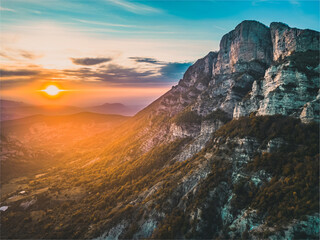 Autumn landscape at Les Trois Becs in Provence Drôme. Panoramic landscape of the valley during sunset. Limestone rocks covered with trees in autumn colors