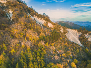 Autumn landscape in Les Trois Becs in Dr&ocirc;me proven&ccedil;ale. The top limestone rocks is covered with autumn colors