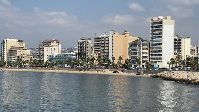 The city of Sidon in Lebanon. Sidon Sea Castle, built by the crusaders - Saida corniche and building. Sidon sea at sunset