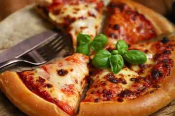 Round pizza margarita on yeast dough. Delicious fresh pizza.