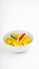 Homemade Manisan or Asinan Mangga is Candied Young Mango Pickles, Thin Sliced Mix with Water and Sugar and then Preserved on a White Bowl.