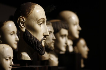 Sculpted head of old wooden saints