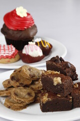 brownies, chocolate chip cookies, cupcake, and cream puffs
