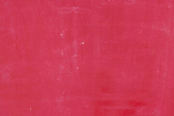 赤く塗られたコンクリート壁のテクスチャーの背景