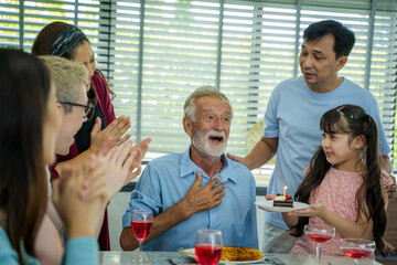 Family birthday party for father,family celebrating grandfather's birthday indoors,Receiving...