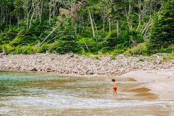 family walking on the beach - Cape Breton highlands national park