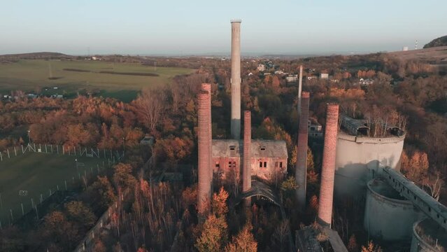 Abandoned old production plant, cement plant in Bedzin, Grodzisk, Poland. Concept of abandoned places, industrial ruins, urbex. View from the drone, air.