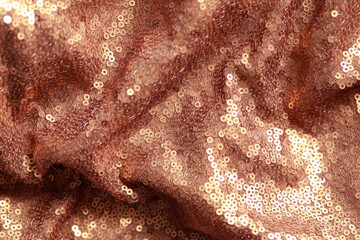 Beautiful golden shiny cloth with sequins as background, top view
