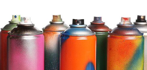 Used cans of spray paints on white background