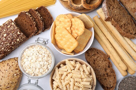 Different gluten free products on white background, flat lay