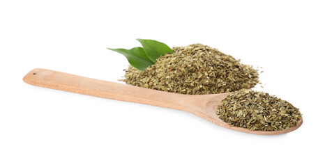 Pile of aromatic mate tea and spoon on white background