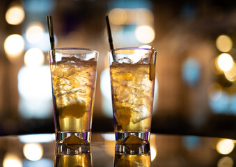 beautiful and delicious alcoholic cocktails prepared at the bar by the bartender.