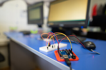engineers assemble electrical circuits from radio components in a laboratory.