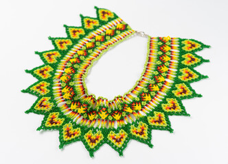 handmade colorful bead necklace close-up isolated on white background.