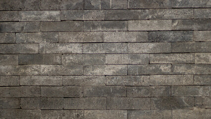 Old stone wall texture with a tiled pattern