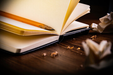 open book with a pencil