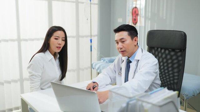 Asian woman patient visit and consult health problem with young doctor.