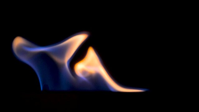 Closeup of flames burning on black background. Biofuel fireplace burn. Modern smart eco alternative technologies. Fuel Crisis, natural gas, world winter crisis. Scene A.