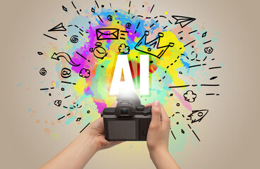 Close-up of a hand holding digital camera with abstract drawing