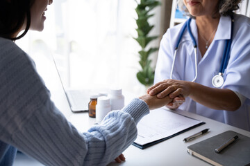 Doctor with patient in medical office, Mature woman with her doctor in hospital talking about healthcare.