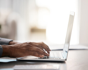 Closeup, hands and typing on laptop with black man at desk for email, communication or digital marketing in office. Zoom, businessman hand and keyboard on computer for strategy, planning or research
