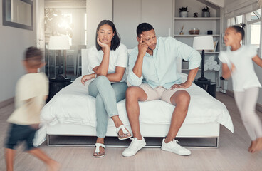 Children, parents and family home with mother and father feeling stress, depressed and burnout of adhd boy and girl making noise. Fatigue and frustrated man, woman and kids with energy for chaos