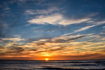 Naklejka na ściany i meble Beautiful sunset over the Atlantic coast