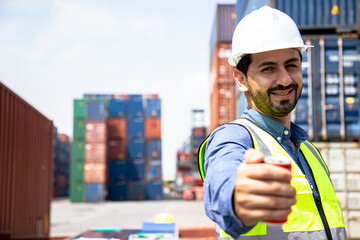 Businessman engineer working in the construction container yard at container depot station for Logistic Import Export