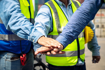 Three engineer shaking hands with deals and congratulations on success at cargo container, Image...