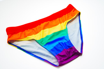 front view. briefs of rainbow color on a white background. swimming trunks for men of non-traditional orientation. a symbol of LGBT.
