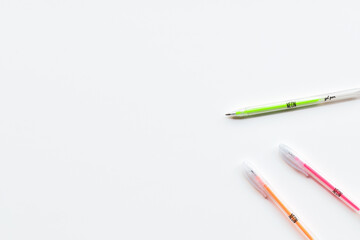 Neon fluo color gel pen on white background