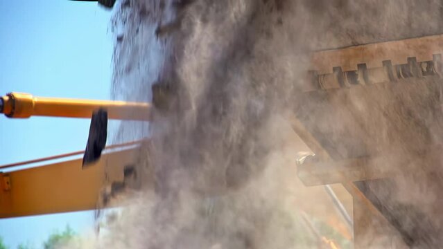 slow motion of a moving conveyor belt with construction waste falling