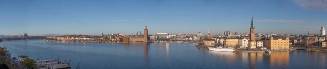 Fototapeta na wymiar Panorama, the bay Riddarfjärden, old town Gamla Stan the down town with Town City Hall a sunny autumn day in Stockholm