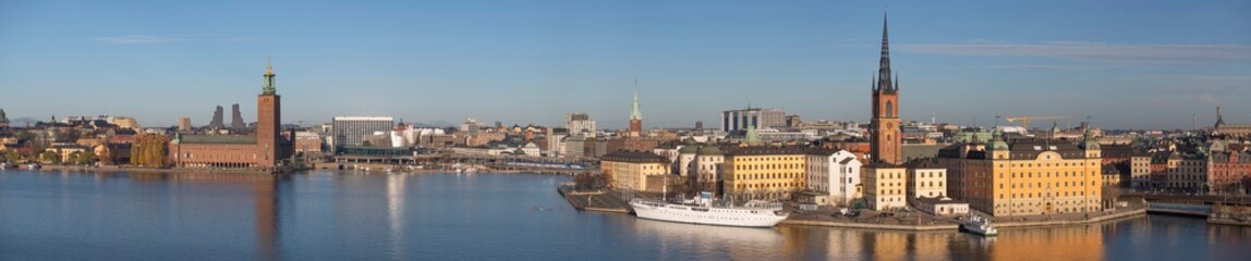 Fototapeta na wymiar Panorama, the bay Riddarfjärden, old town Gamla Stan the down town with Town City Hall a sunny autumn day in Stockholm 