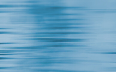 Abstract light blue pattern of horizontal stripes of different thicknesses.	