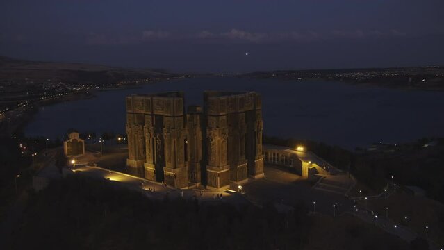 Drone round shot of at Chronicle of Georgia at night, Tbilisi, USA. wide angle.